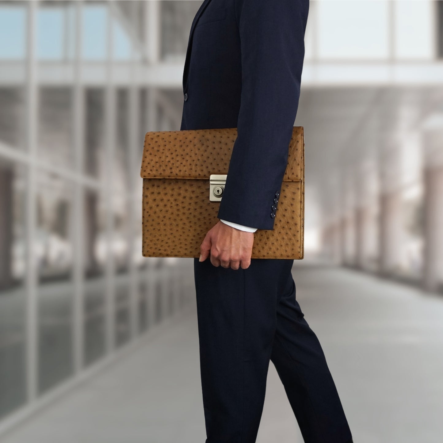 Briefcase in brown with silver-colored, lockable closure