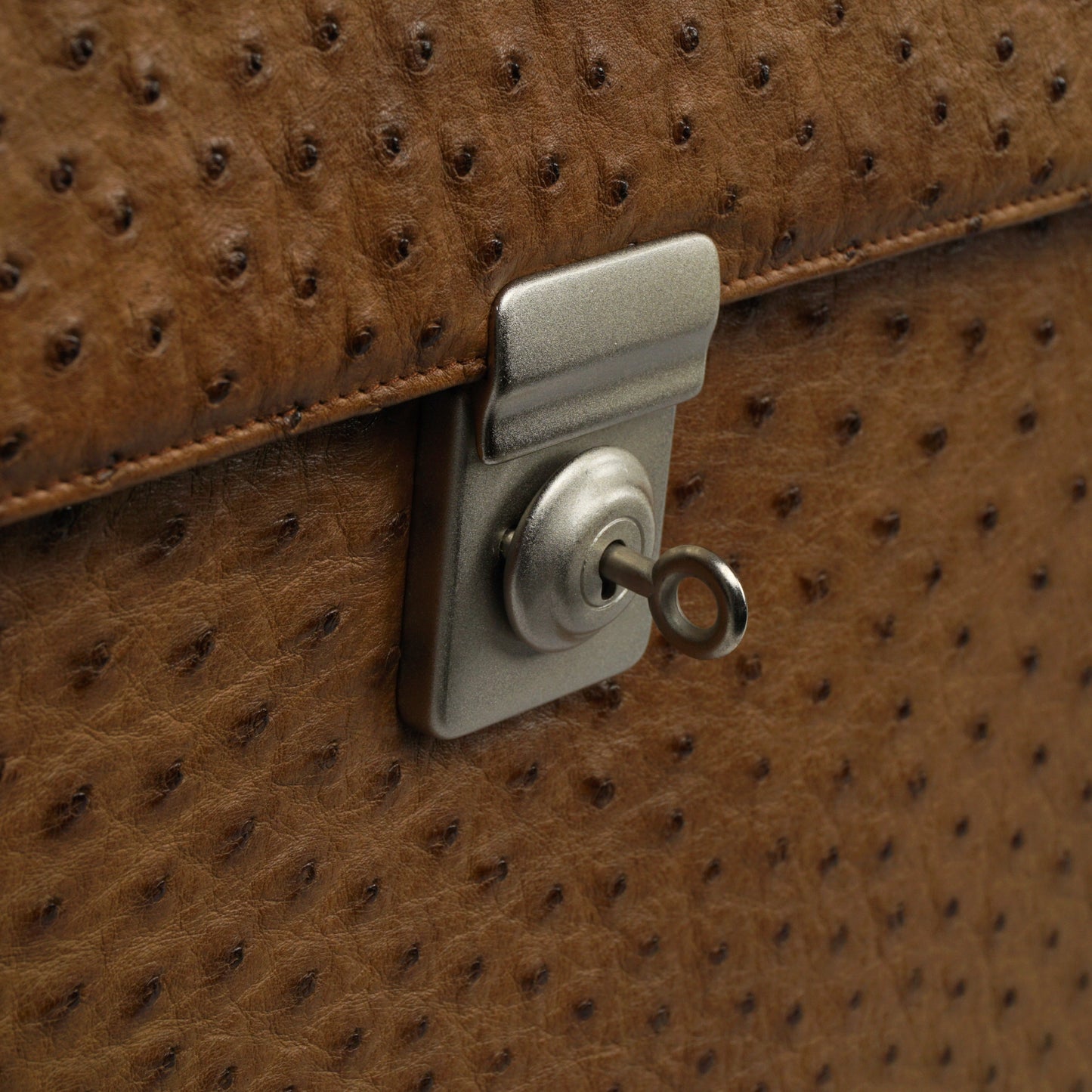 Briefcase in brown with silver-colored, lockable closure