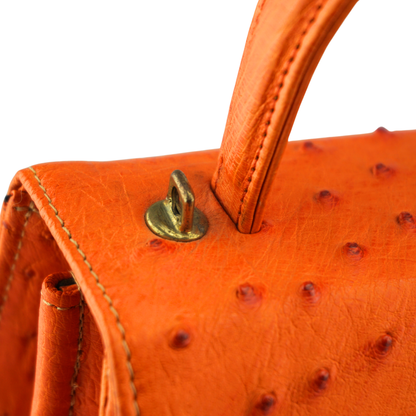 Straußenleder Henkeltasche in Orange mit goldfarbenen Details